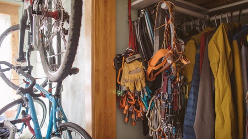 Every available hook and bar was recruited to hold gear, be it for running, climbing, biking, or skiing.