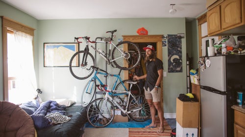 Krupicka makes the most of his small space, with a three-bike wall rack and cabinets stuffed with gear.