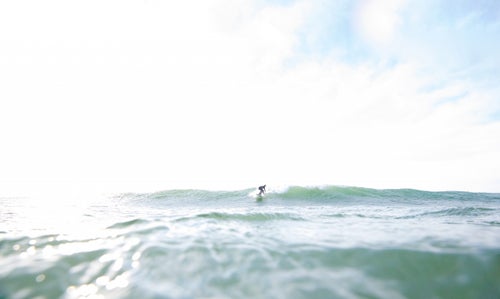 Therrien enjoying a sunny-day swell in Frankfort, Michigan鈥攁 freshwater surfing hot spot.
