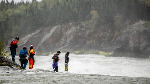 Doused in rain, Kalob Grady, Bren Orton, Dane Jackson, Jon Patterson, and Tom Patterson look on at the chaos of White Mud Falls, the only rapid on the Nelson which has still not been attempted.
