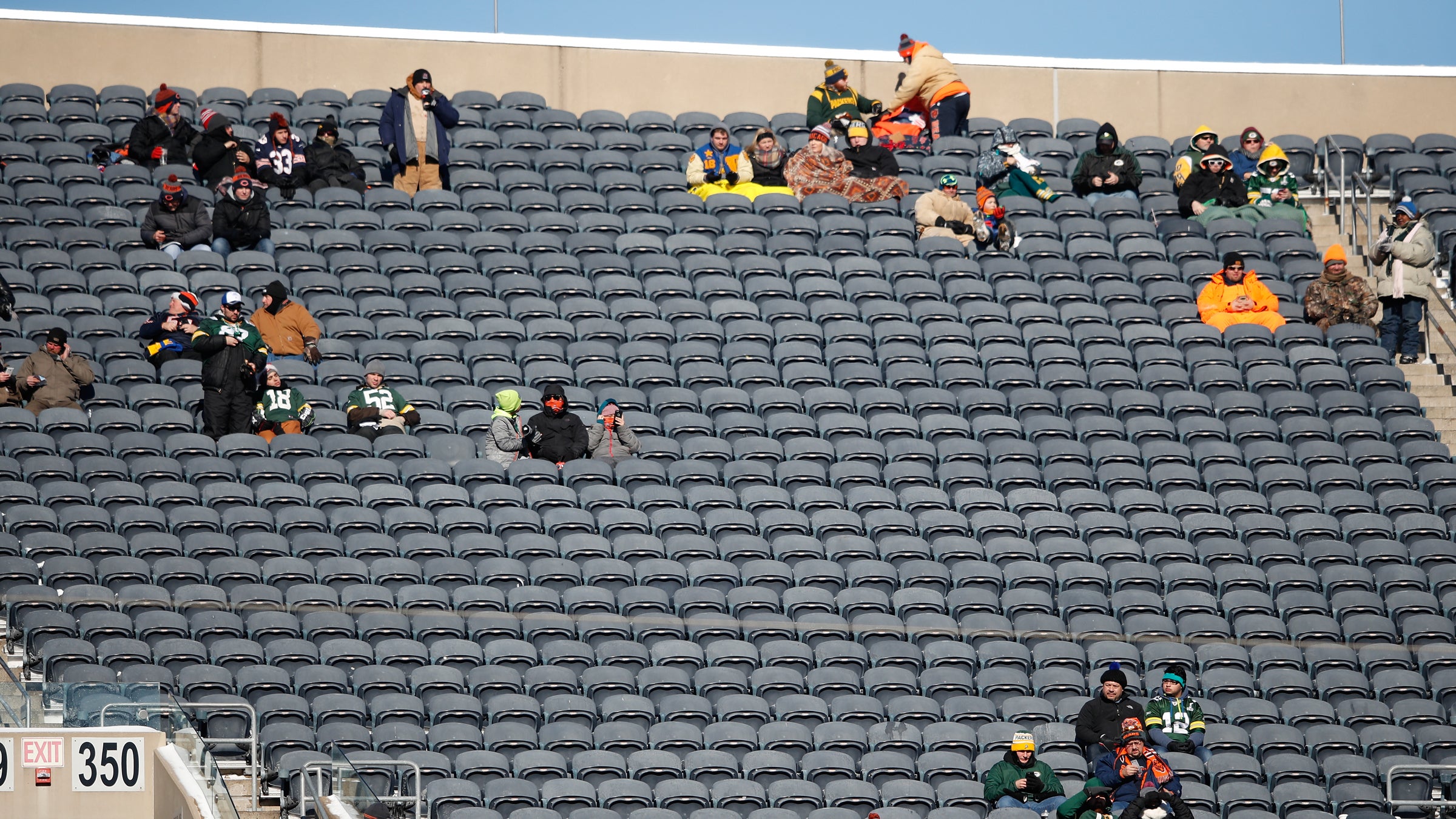 Tribal instincts keep these hardcore NFL fans in seats beyond the freezing point of their drinks.