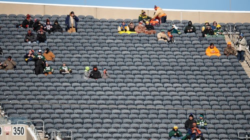 Tribal instincts keep these hardcore NFL fans in seats beyond the freezing point of their drinks.