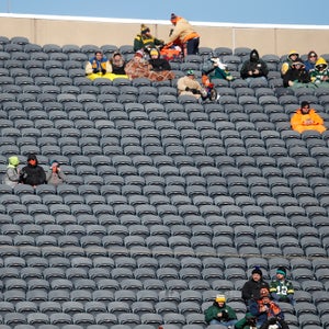 Tribal instincts keep these hardcore NFL fans in seats beyond the freezing point of their drinks.