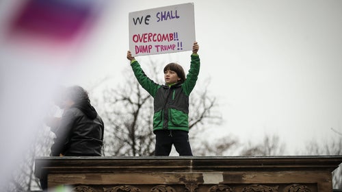 A  young protestor holds up a sign during the Women's March on Washington January 21, 2017 in Washington, DC.
