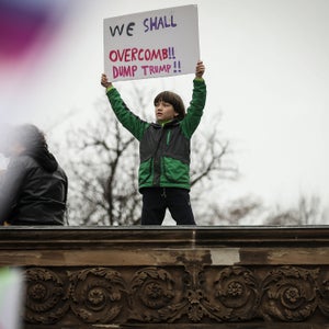 A  young protestor holds up a sign during the Women's March on Washington January 21, 2017 in Washington, DC.