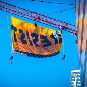GreenPeace unfurls a