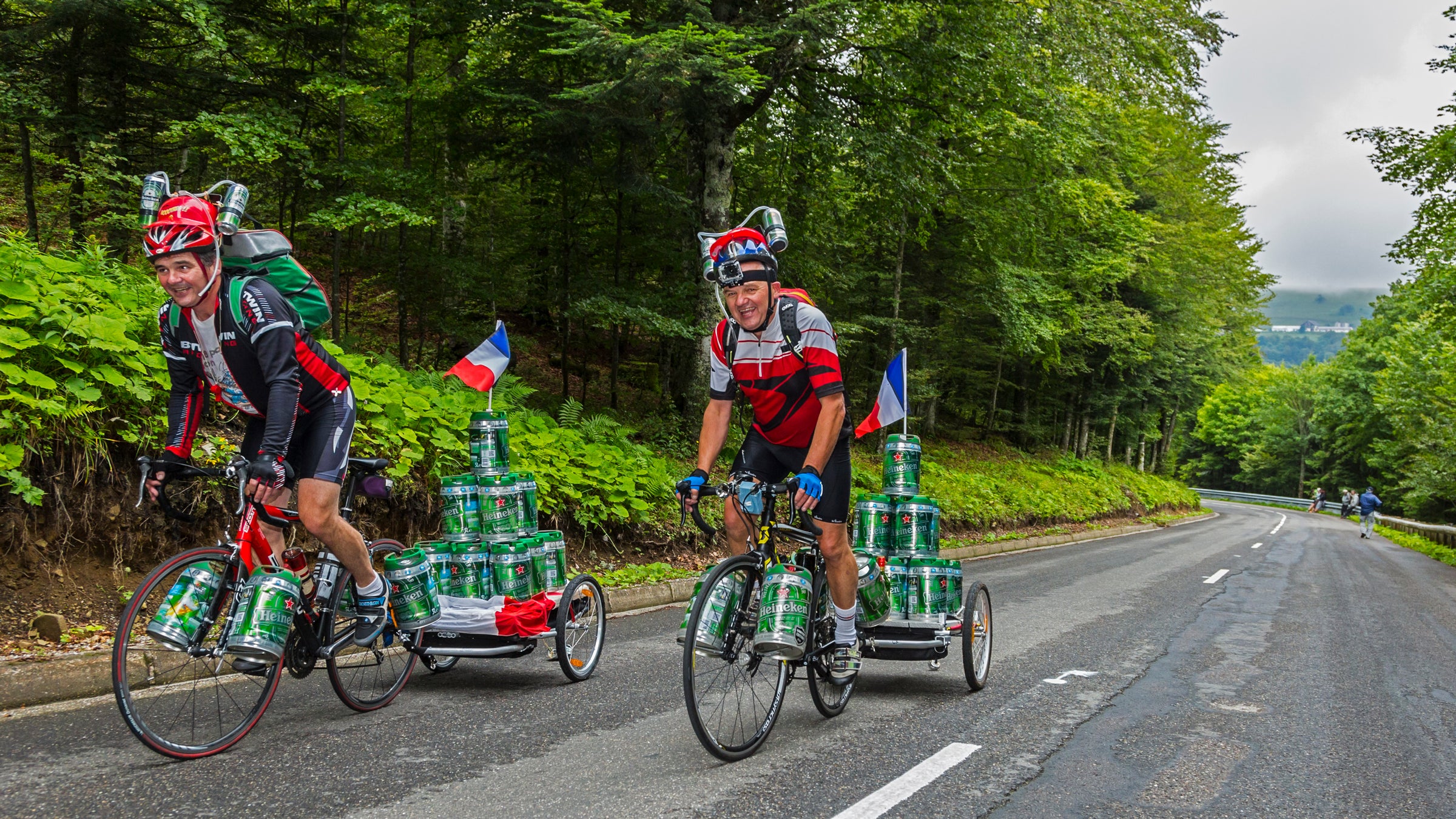 One way to make beer into a health food: use it to weigh down your bike on a mountain pass.