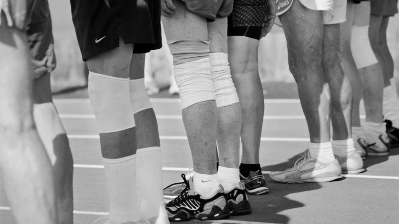 Masters track and field athletes in the M80 and M85+ divisions of the men's decathlon stand ready for the start of the 1,500 meters in Lyon, France, during the 2015 World Masters Athletics Championships.