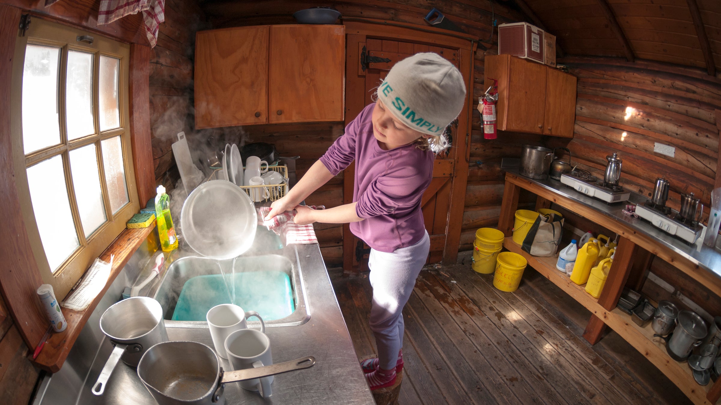 Doing dishes in the Elizabeth Parker Hut in Yoho National Park, British Columbia.