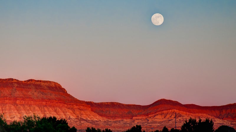 Moon hangs over St. George, Utah.