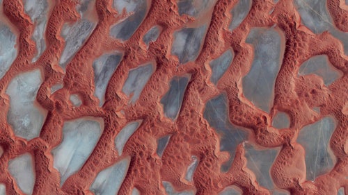Rub鈥 al Khali, or the Empty Quarter, is the largest sand desert in the world. It covers 251,000 square miles, and includes parts of Saudi Arabia, Oman, Yemen, and the United Arab Emirates. In the center of the desert there are a number of raised, hardened formations that were once the sites of shallow lakes thousands of years ago. For a sense of scale, this image shows approximately 135 square miles in Saudi Arabia, near the border with Oman.