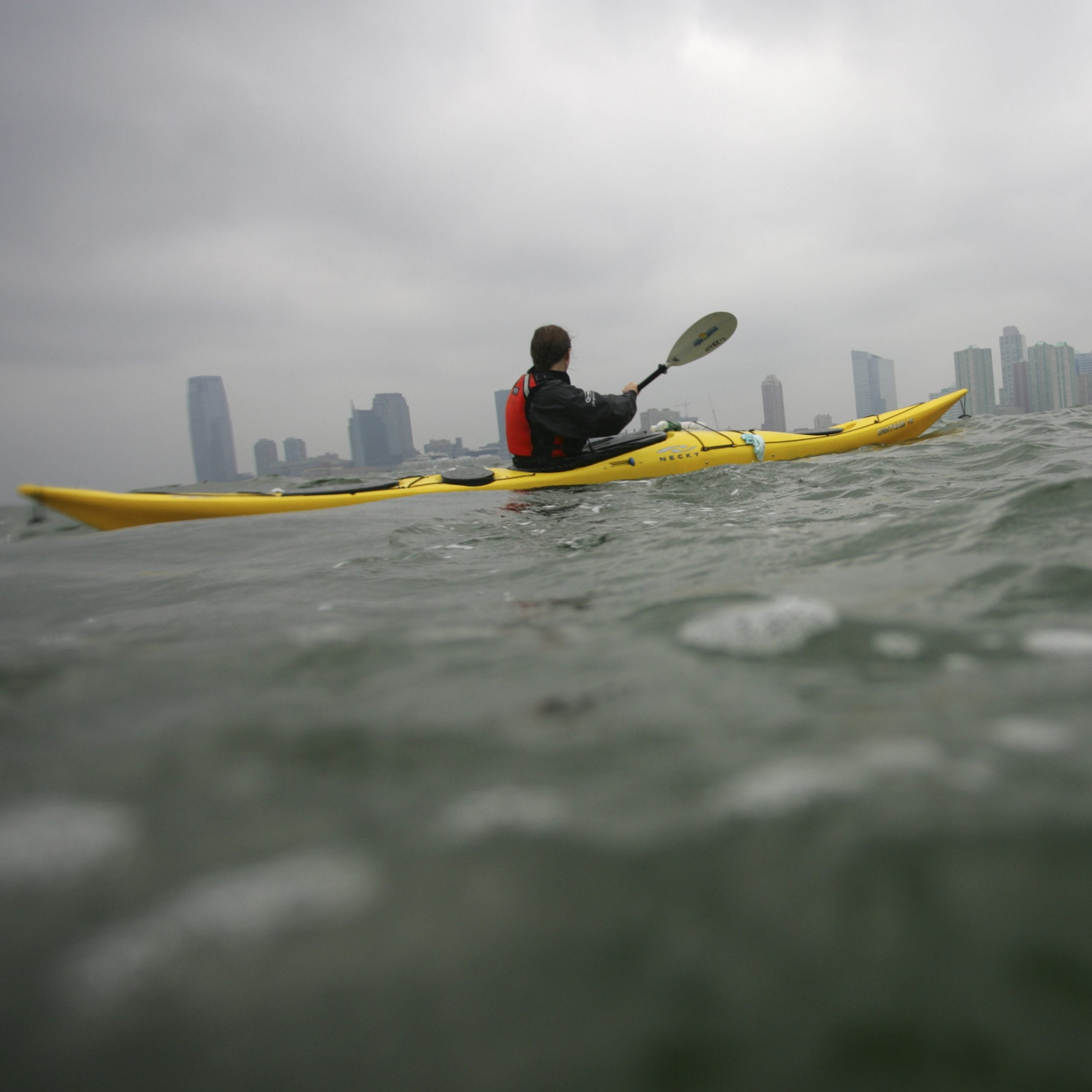 Sea kayaker paddles along the Hudson River.