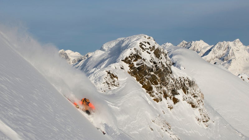 Ski guide Dave Gauley makes the first steep turns off of Jans Perch, a tiny summit in the Cariboo Mountains of British Columbia.