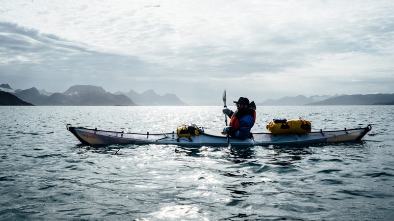 Chris paddles his Oru Coast+, loaded down with camping and mountaineering gear.