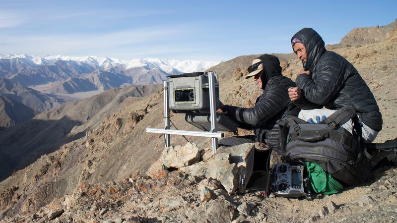 In Ladakh, India, the local team set up and check on a camera trap positioned on a route frequently used by snow leopards crossing these mountains.