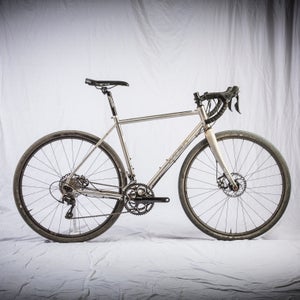 This versatile, stainless steel Osto Warakin road bike is also geared for gritty, off-road adventure.