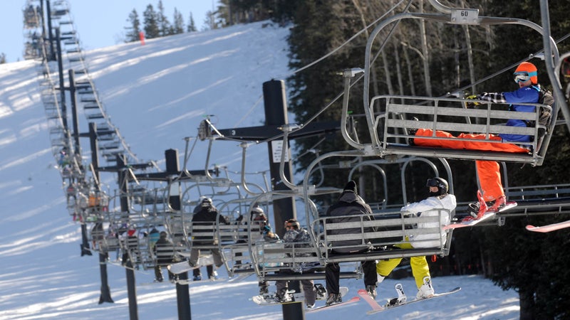 Chairlifts at the Arizona Snowbowl near Flagstaff, Arizona carry skiers uphill.