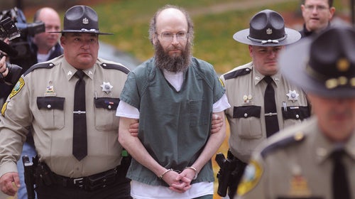 Christopher Knight is escorted into Kennebec County Superior Court in Augusta, Maine, on October 28, 2013.