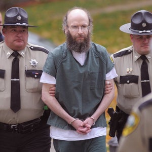 FILE - In an Oct. 28, 2013 file photo, Christopher Knight, center, is escorted into Kennebec County Superior Court, in Augusta, Maine where entered pleas for multiple burglaries and thefts while living in the woods of Rome, Maine, for 27 years. Knight, who has has finished a special court program, attended a hearing Monday, March 23, 2015, in Kennebec County Superior Court and will begin three years' probation. Attorney Walt McKee says Knight has been working for his brother in exchange for room and board. He says Knight is participating in a vocational rehabilitation program to develop skills for a regular job. (AP Photo/Andy Molloy, Kennebec Journal)