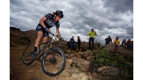 Dax Massey, of Denver, Colorado, rides before the storm for team Roca Roja Rollers. He finished with a fast lap time of 01:01:36.