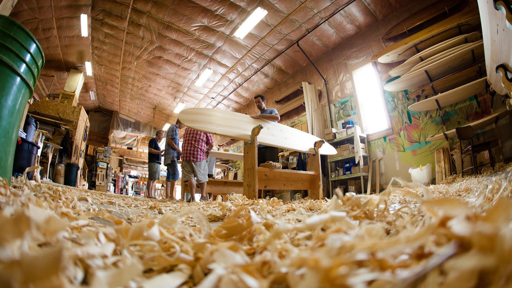 Maine-based Grain Surfboards teaches how to handcraft custom wooden surfboards using sustainable materials and methods.
