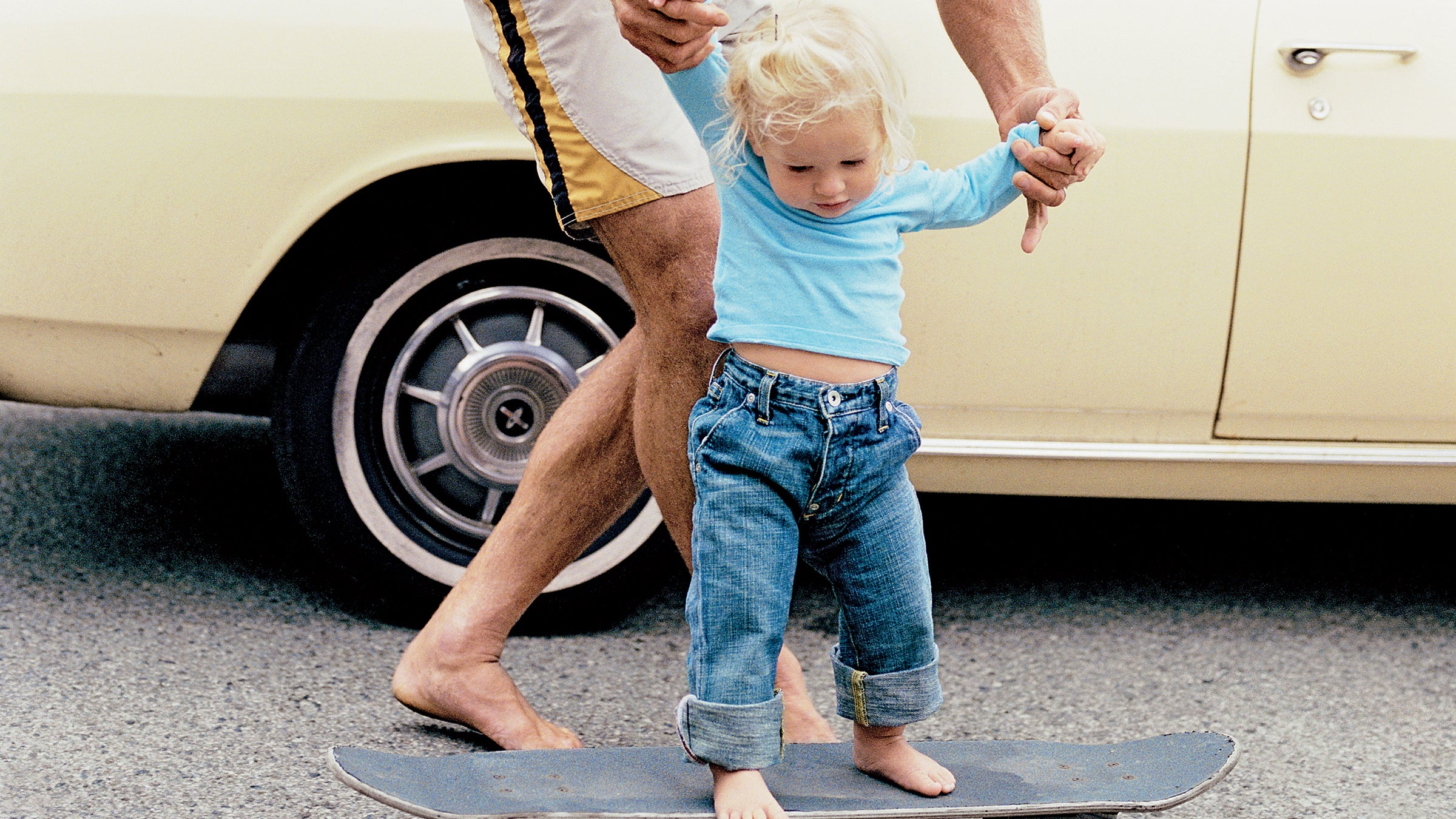 Early does it: Laird Hamilton introduces his daughter Reece, age one, to board sports