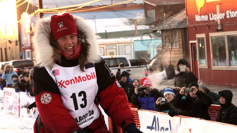 Zirkle drives her team to the Nome finish line of the 2016 Iditarod after she was attacked by a snowmobile driver in an isolated stretch of the route.