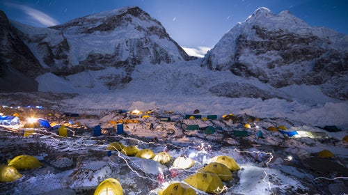 Headlamps weave through the basecamp at Mount Everest.