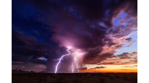 The majesty of the summer monsoon in Arizona. An isolated storm dropping lightning strikes at sunset. One of my favorite settings.