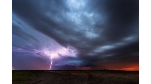 A storm that had previously dropped a tornado in New Mexico moves into Texas at sunset and creates some epic colors and lightning.