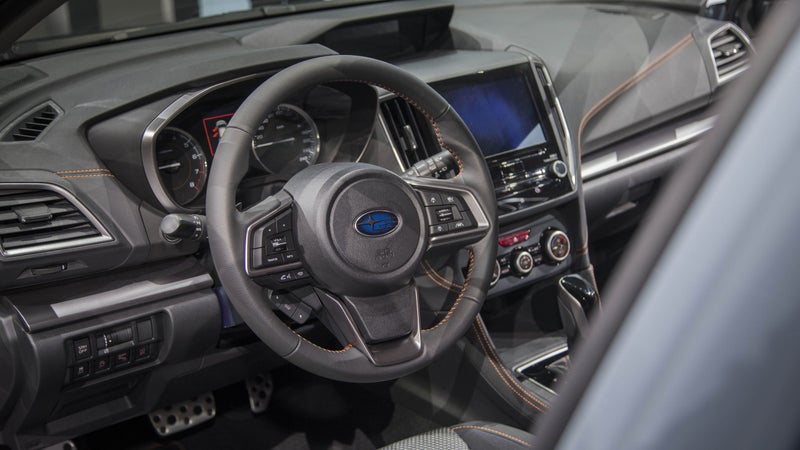 The interior gets a fancy new touchscreen, as well as nicer materials. Orange stitching separates the Crosstrek interior from that of the regular Impreza.