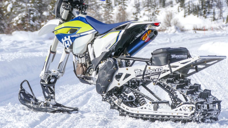 The kits replace the front wheel and brake with a ski and the rear wheel, brake, swingarm, and shock with an all-in-one track unit. Everything bolts on in your garage.