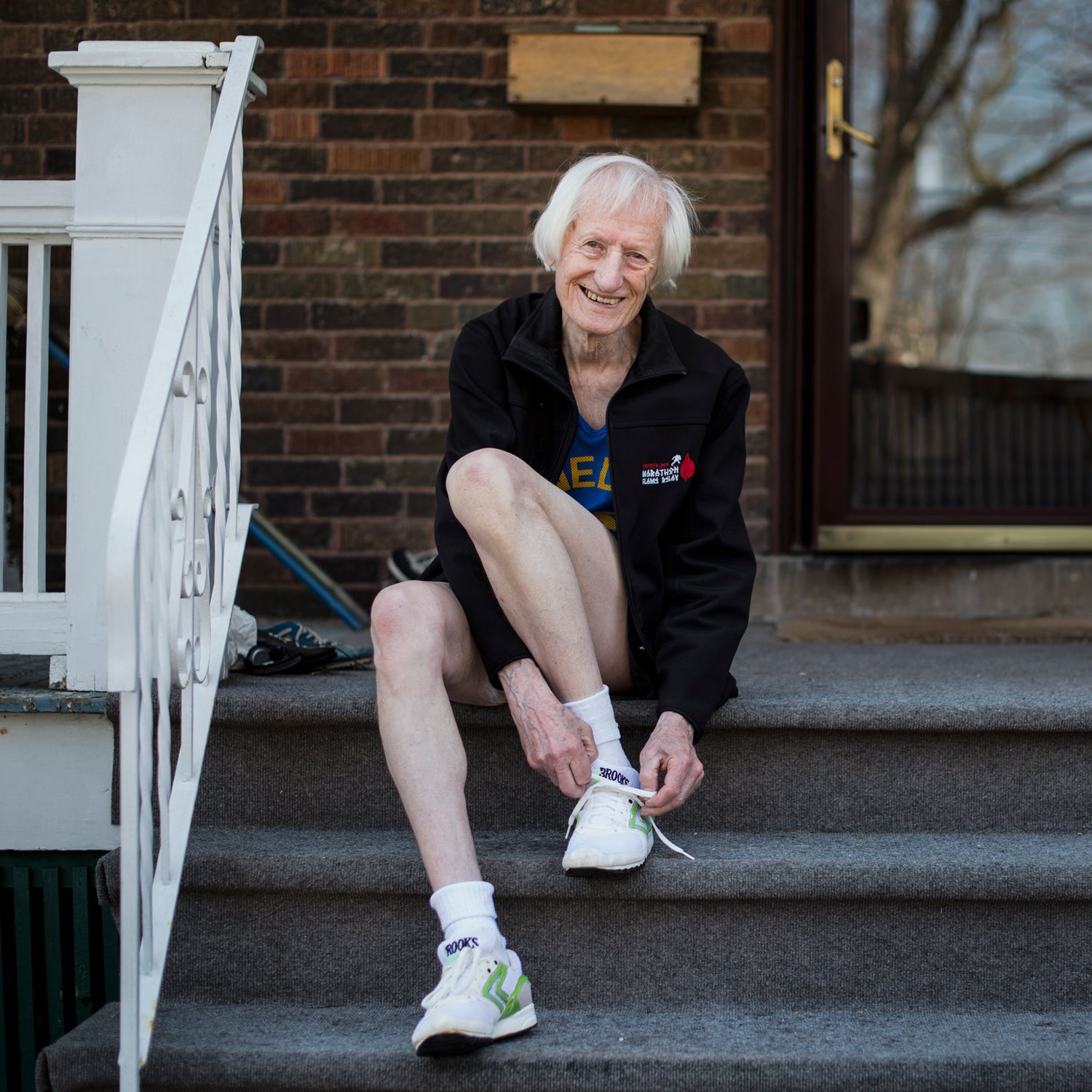 Ed tying his faithful old pair of Brooks shoes for a run.