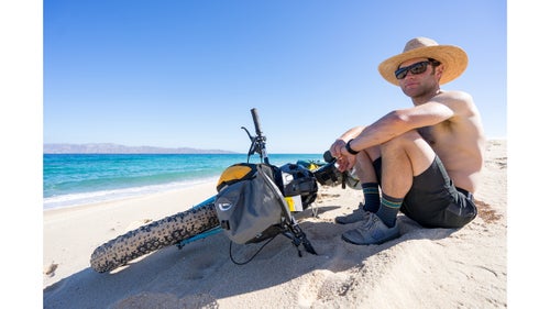 Carr soaks up the morning sun after a sunrise mission to ride the beach about 16 miles from La Ventana to Bah铆a de Los Muertos. After almost ten miles of beach riding on the eastern coast, we stopped here for breakfast and to enjoy the incredible views and tranquility. The beach had become impassable due to variable conditions, so after a quick cold coffee and makeshift quesadilla, we set our sights on Los Barriles, 34 miles to the south.