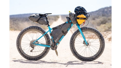 We chose to ride fat bikes with four-inch-wide tires for our adventure, with the intention of getting in some serious beach miles. Although Carr鈥檚 setup was a bit overkill for most of the riding we did, the beach riding was a great way to mix things up. He used a Trek Farley fitted with Defiant pack bags. The seat bag carried clothes and up to three days鈥 worth of food at a time, while the custom-made frame bag housed a three-liter bladder, a jacket for quick access, flip-flops, and a book. The rolltop feed bag contained a mix of cookies, a knife, and our state-of-the-art navigating device: Carr鈥檚 iPhone.