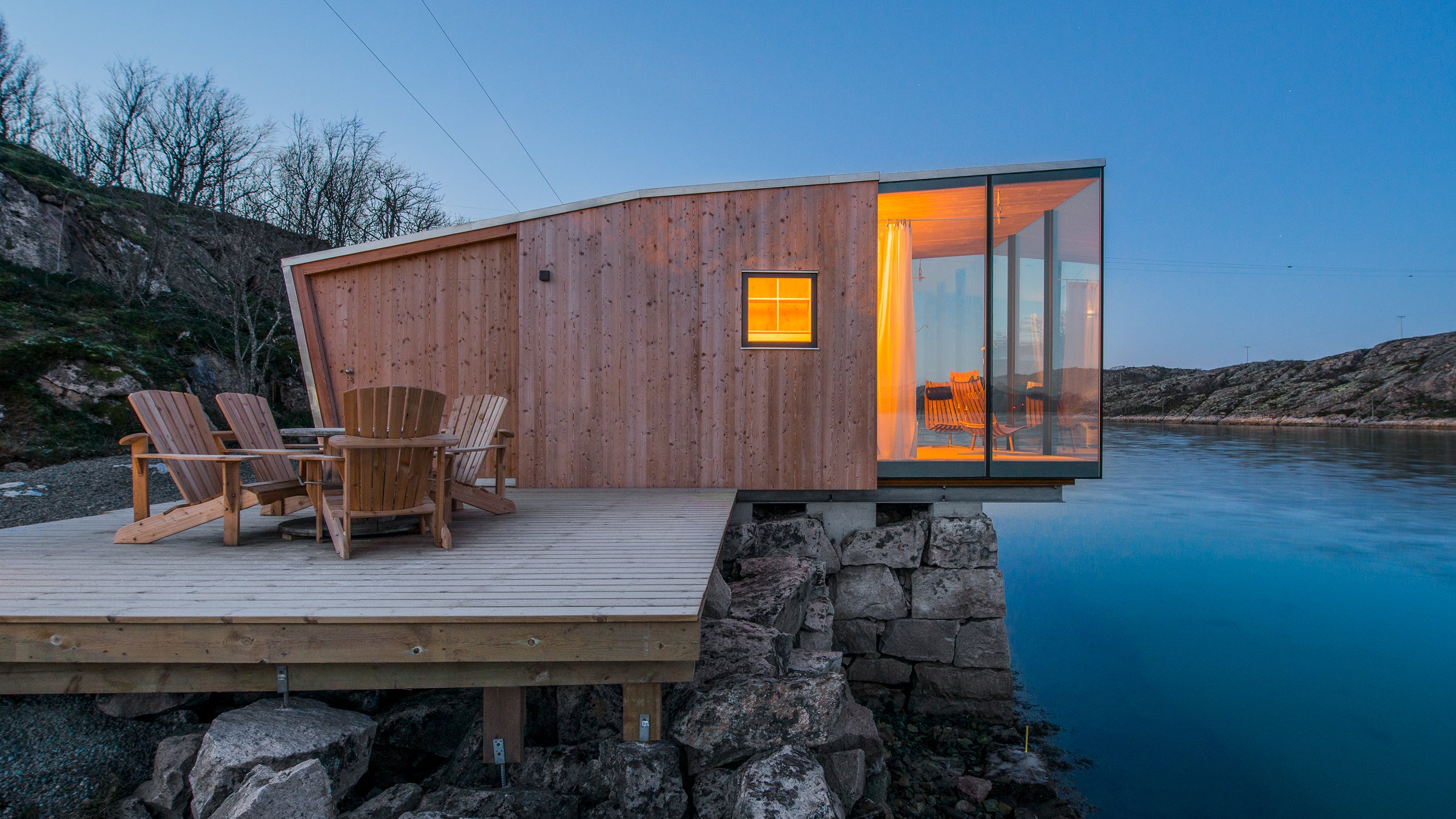 A sea cabin cantilevered over the Grotoya Strait, Manshausen Island, Norway.