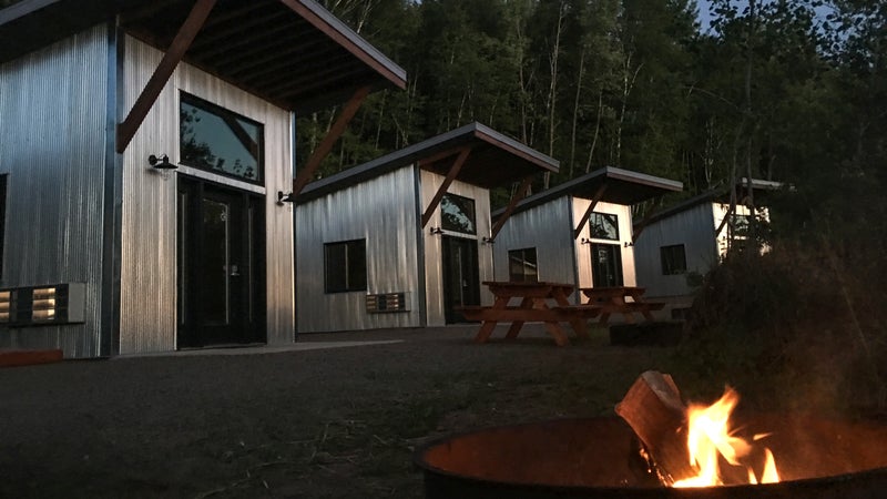 Lakeside cabins designed to replicate 19th century mining shacks.