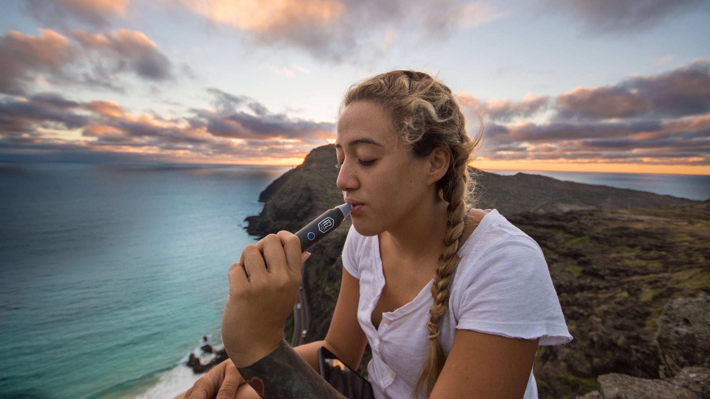 A healthy toke at the top of a hike—minus the smoke.