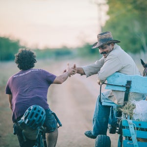On January 1, my wife, Virginia, and I joined our riding buddy Joe Cruz and set out to cycle across Cuba using mainly rugged dirt tracks, horse paths, and mountain roads. As with all of our bikepacking trips, the objective was to dig ourselves into the backwaters of our new surroundings and find out what the country is really like. We began on the eastern coast, in the city of Santiago de Cuba, and rode through three mountain ranges, countless fishing and farming villages, and finally into Viñales, on the opposite coast. Ultimately, we discovered a country full of warm people, quirky eccentricities, and natural beauty. 
Here, Logan Watts, the editor at Bikepacking.com, shares a selection of images from their 860-mile, 20-day trip. 
Photo:Many times, folks insisted on stopping us to hear where we were from and where we were going. Other times, they just reached out their hand for a friendly shake.
