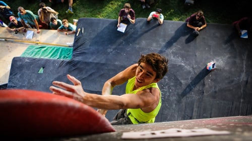 A moment before falling, Lucas Gaona (Chile) swipes at the top hold in the first route of the finals. Competitors were given four minutes to attempt each problem, during which they were allowed to fall and re-try as many times as they were able to. As long as their feet were off the ground by the time the buzzer sounded, a final attempt at the route was fair game.