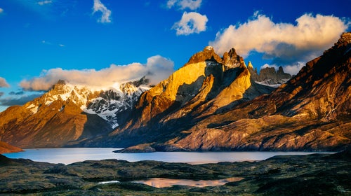 In the southern part of Chile's Patagonia, the sun rises over the country's vast, mountainous landscapes.