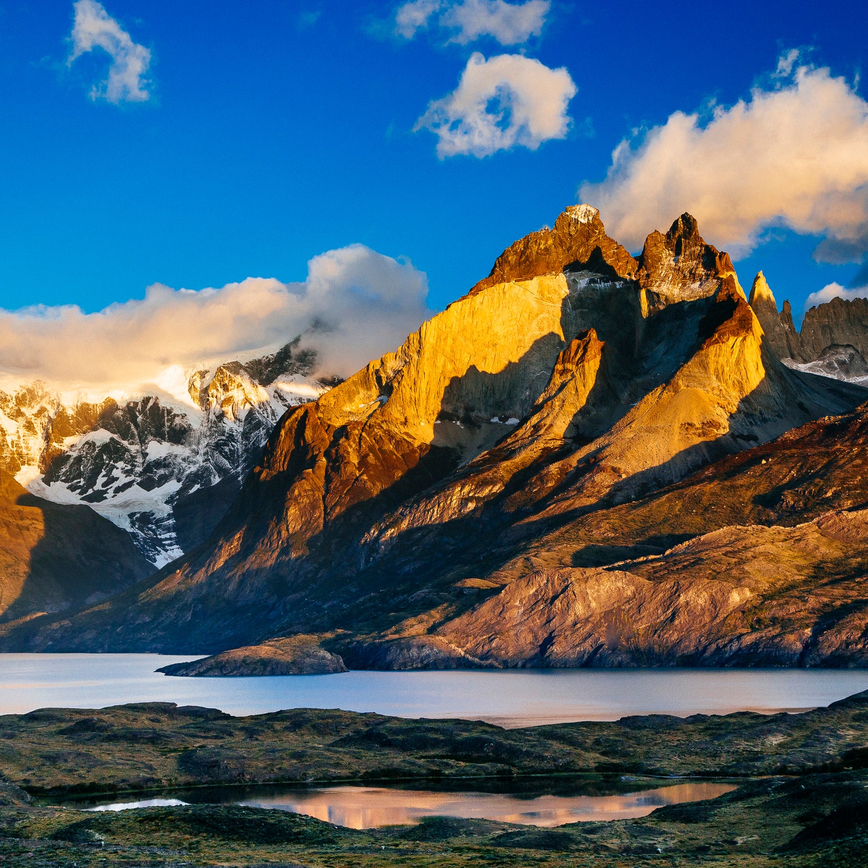 In the southern part of Chile's Patagonia, the sun rises over the country's vast, mountainous landscapes.