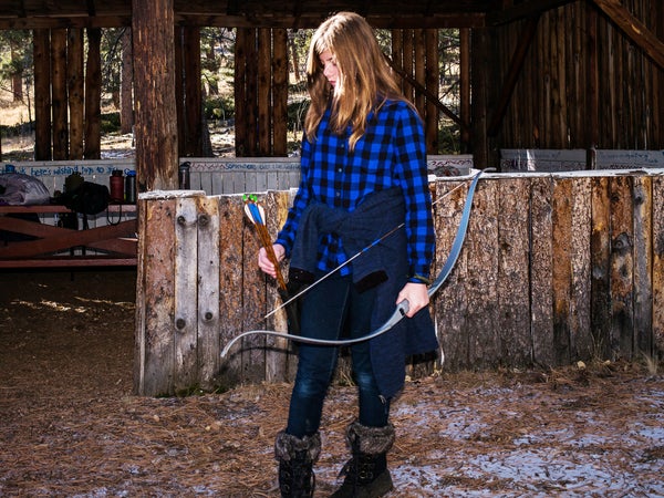 Colorado scout Meghan, 13, on the archery range during an Outdoor ԹϺ Club sleepover at Tomahawk Ranch