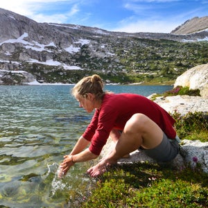 Washing up in a pristine lake after a long day of hiking in the Sierra Nevadas