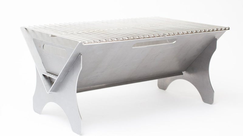 Fold-a-Flame's new flatpack grills are rugged and spacious. This one has room for standard-length firewood and enough grill space for a dozen or more burgers.