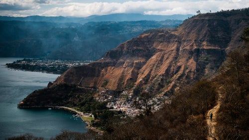 Here, Eric Porter rides the Santa Cat Trail into Santa Catarina de Palopo, on the shores of Lake Atitl谩n. The trail weaves through small farms before dropping down a series of staircases directly through town.