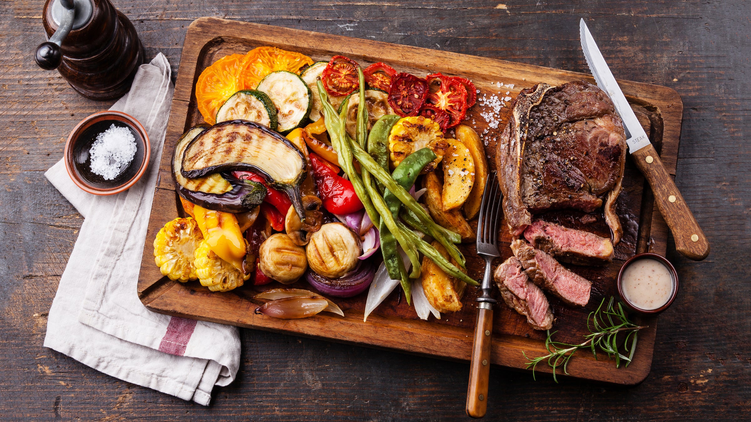 Steak with pepper sauce and grilled vegetables—a favorite among post-race meals. 