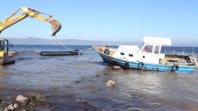 Refugee boats being destroyed.