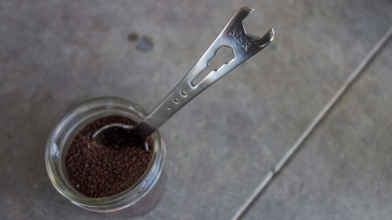 I seal my ground coffee in a small mason jar. That's airtight, so it keeps the coffee plenty fresh. A spoonful from the MSR Alpine Tool Spoon is about right for the Aeropress.