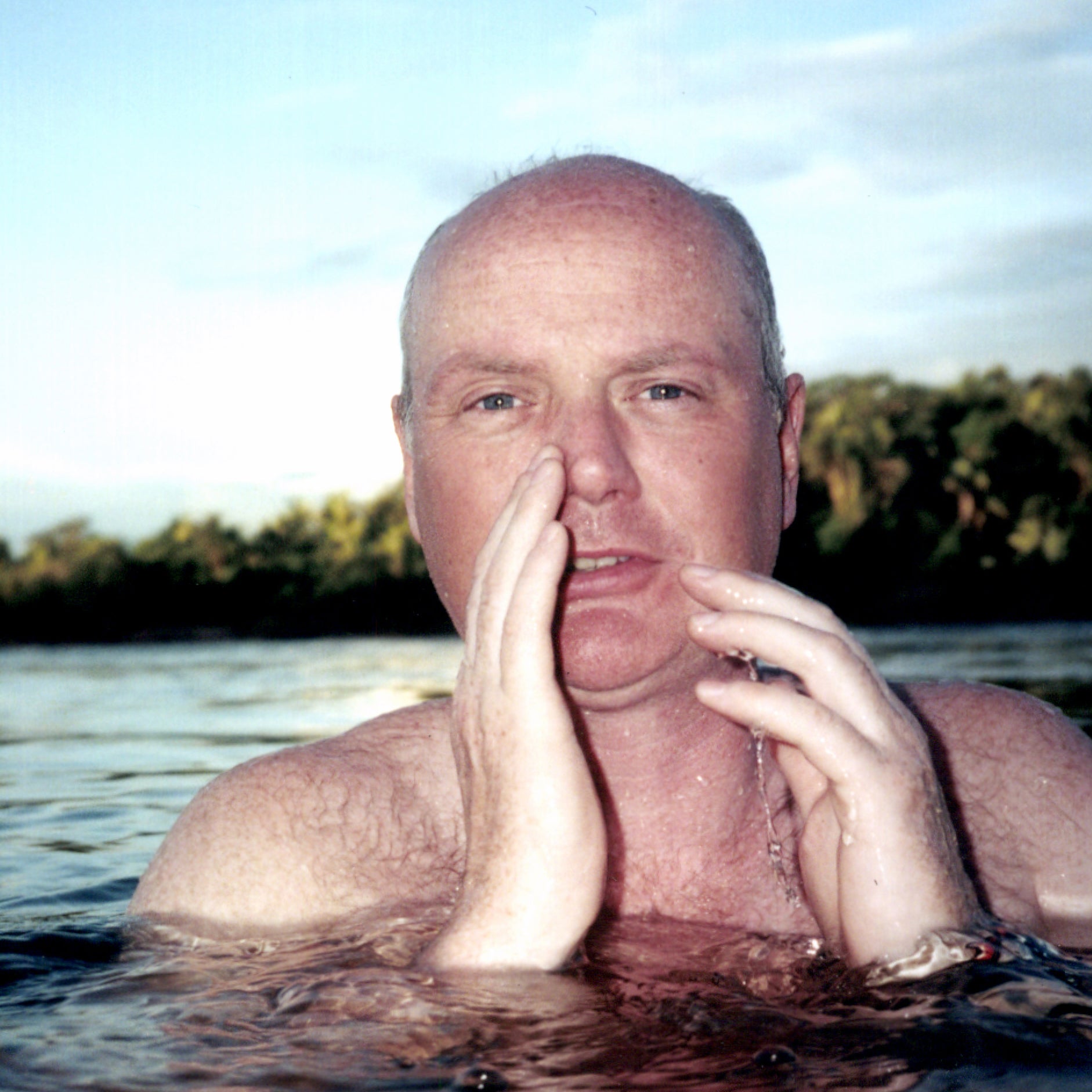 Patrick Symmes is notorious for travelling to conflict-prone areas around the globe. Here, he swims in Brazil's Xingu river.